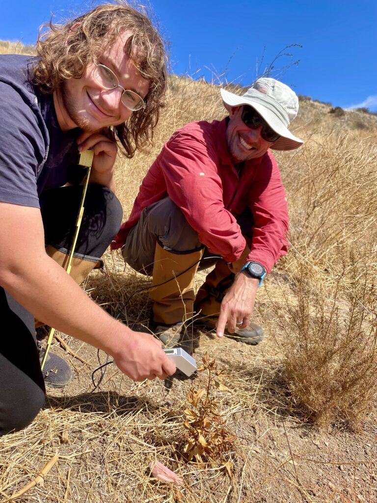 Dr. Pratt with graduate student Antonio Mateiro studying the factors controlling mortality in a chaparral restoration study near Lake Piru in southern California.